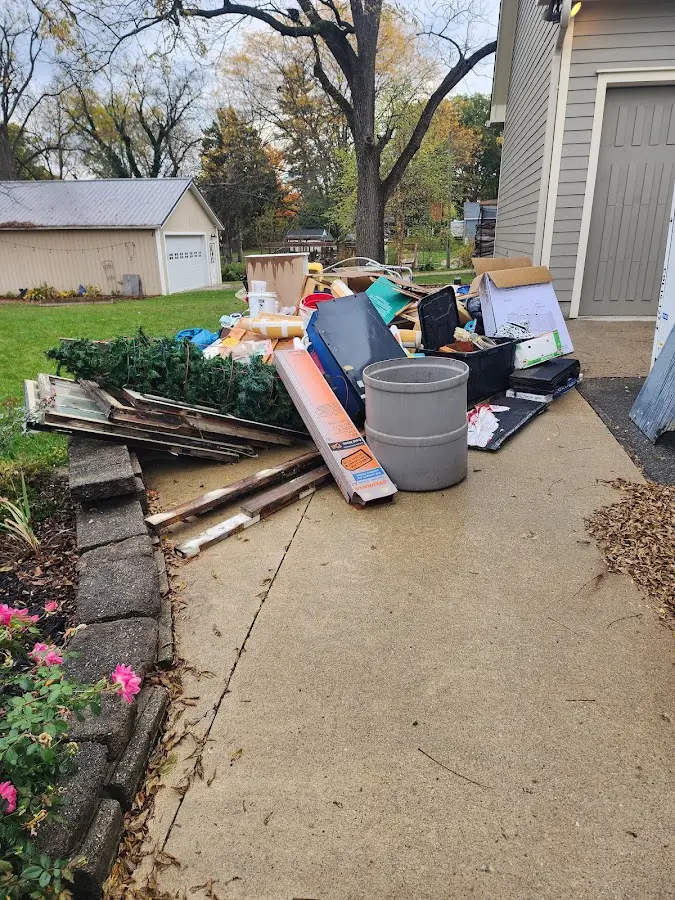 Dumpster being loaded with debris for 3 Yard Dumpster Rental in Bret Harte